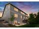 Backyard view with fire pit and stairs leading to the upstairs deck at 12032 Triple Crown Dr, Parker, CO 80134
