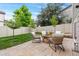 Beautiful backyard with stone patio, fire pit, and manicured lawn, perfect for outdoor gatherings at 12032 Triple Crown Dr, Parker, CO 80134