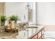 Close up on a bathroom featuring granite counters, wood cabinets, a round sink, and stylish decor at 12032 Triple Crown Dr, Parker, CO 80134