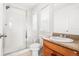Bathroom featuring a glass shower, tile, sink, toilet, and granite countertop at 12032 Triple Crown Dr, Parker, CO 80134