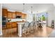 Open kitchen with an island, granite countertops, pendant lighting, and counter seating at 12032 Triple Crown Dr, Parker, CO 80134