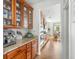 Well-appointed kitchen with granite countertops, wood cabinets, stainless steel appliances, and hardwood floors at 12032 Triple Crown Dr, Parker, CO 80134