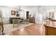 Bright living room with hardwood floors, plantation shutters, a stylish rug, and elegant decor at 12032 Triple Crown Dr, Parker, CO 80134