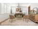 Bright living room with hardwood floors, plantation shutters, a stylish rug, and elegant decor at 12032 Triple Crown Dr, Parker, CO 80134