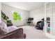 Bright office with a sofa, desk, and massage chair at 12032 Triple Crown Dr, Parker, CO 80134