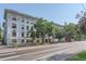 An exterior side view of a large apartment building showcasing its classic architectural design and surrounding streetscape at 215 E 11Th Ave # B9, Denver, CO 80203