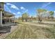Spacious backyard with healthy green grass and large trees, perfect for outdoor activities at 10707 W Cooper Dr, Littleton, CO 80127