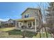 Large green backyard with a covered patio, perfect for outdoor entertaining at 10707 W Cooper Dr, Littleton, CO 80127
