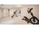 Finished basement with an open floor plan and room for fitness equipment at 10707 W Cooper Dr, Littleton, CO 80127