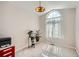 Bright bedroom with a large window and custom lighting fixtures at 10707 W Cooper Dr, Littleton, CO 80127