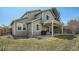 Two story home with an open, covered patio and well manicured backyard at 10707 W Cooper Dr, Littleton, CO 80127