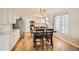 Well-lit kitchen with stainless steel appliances and adjacent dining area at 10707 W Cooper Dr, Littleton, CO 80127