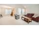 Bright living room showcasing high ceilings and seamless transition to dining area at 10707 W Cooper Dr, Littleton, CO 80127