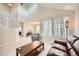 Spacious living room with large windows, tall ceilings, and staircase at 10707 W Cooper Dr, Littleton, CO 80127