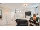 Open upstairs area features chair and TV at 10707 W Cooper Dr, Littleton, CO 80127