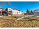 Large backyard with play area and basketball hoop at 4790 E Dartmouth Ave, Denver, CO 80222