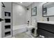 Modern bathroom with subway tile, freestanding tub, and floating vanity at 4790 E Dartmouth Ave, Denver, CO 80222