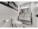 Modern bathroom featuring a sleek vanity, stylish mirror, and neutral color scheme at 4790 E Dartmouth Ave, Denver, CO 80222