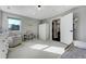 Bright bedroom with a window, closet, and an en-suite bathroom for added convenience at 4790 E Dartmouth Ave, Denver, CO 80222