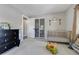Cozy Bedroom with a crib, dresser, and playful decor, creating a warm atmosphere at 4790 E Dartmouth Ave, Denver, CO 80222