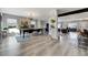 Open concept dining room showcasing hardwood floors and stylish lighting at 4790 E Dartmouth Ave, Denver, CO 80222