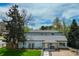 Charming gray home with a well-maintained front yard and a welcoming front porch at 4790 E Dartmouth Ave, Denver, CO 80222