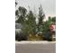 Landscaped curb appeal with colorful flowers and a neatly trimmed lawn at 4790 E Dartmouth Ave, Denver, CO 80222