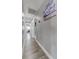 Bright hallway with grey walls and wood-look tile flooring at 4790 E Dartmouth Ave, Denver, CO 80222