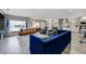 Bright open living room with light wood floors, large windows, and stylish modern furnishings at 4790 E Dartmouth Ave, Denver, CO 80222