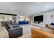 Inviting living area with comfortable seating, large television, and stylish decor at 4790 E Dartmouth Ave, Denver, CO 80222