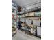 Walk-in pantry with ample shelving for organized storage of food and kitchen essentials at 4790 E Dartmouth Ave, Denver, CO 80222