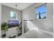 Bright staircase with city view and modern lighting at 4790 E Dartmouth Ave, Denver, CO 80222