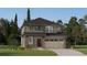 Charming two-story home with stone accents, a two-car garage and professionally landscaped front yard at 10976 Snowdon St, Parker, CO 80134