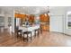 Open kitchen with an island and breakfast bar seating, stainless appliances, and a pantry at 12702 E 105Th Ave, Commerce City, CO 80022