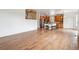 Open-concept living space leading into the kitchen with eat-in breakfast bar at 12702 E 105Th Ave, Commerce City, CO 80022