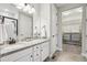 Modern bathroom features granite counters, updated cabinets and a walk-in shower at 2328 Saddle Back Ct, Fort Lupton, CO 80621