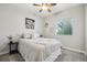 Cozy bedroom with neutral tones, plush carpet, and a ceiling fan at 2328 Saddle Back Ct, Fort Lupton, CO 80621