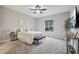 Spacious bedroom with neutral tones, plush carpet, and a ceiling fan at 2328 Saddle Back Ct, Fort Lupton, CO 80621