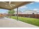 Inviting covered patio offering a relaxing outdoor living space with a ceiling fan at 2328 Saddle Back Ct, Fort Lupton, CO 80621