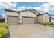 Charming home featuring a two-car garage and a well-maintained front yard with mature landscaping at 2328 Saddle Back Ct, Fort Lupton, CO 80621