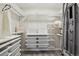 Walk-in closet has a custom organization system with shelves and hanging rods at 2328 Saddle Back Ct, Fort Lupton, CO 80621