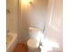 Clean bathroom featuring a toilet next to the tub and wooden floors at 28127 Knowles Rd # Ab&C, Evergreen, CO 80439