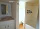 Bathroom featuring a single sink vanity and bath/shower at 28127 Knowles Rd # Ab&C, Evergreen, CO 80439