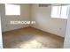 An empty bedroom with neutral carpet, white walls, and two windows offering natural light at 28127 Knowles Rd # Ab&C, Evergreen, CO 80439