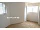 Bedroom featuring neutral carpet, closet and natural light from windows at 28127 Knowles Rd # Ab&C, Evergreen, CO 80439