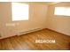 This sunlit bedroom showcases laminate floors and baseboard heating for comfort at 28127 Knowles Rd # Ab&C, Evergreen, CO 80439
