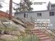 Exterior view of the unit with the stairs leading to private entrance at 28127 Knowles Rd # Ab&C, Evergreen, CO 80439