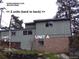 Exterior view of multi-unit complex with brick and siding at 28127 Knowles Rd # Ab&C, Evergreen, CO 80439
