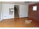A spacious living room with laminate floors and stairs to the upper level at 28127 Knowles Rd # Ab&C, Evergreen, CO 80439