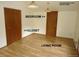 The living room features a wood-look floor and closet at 28127 Knowles Rd # Ab&C, Evergreen, CO 80439